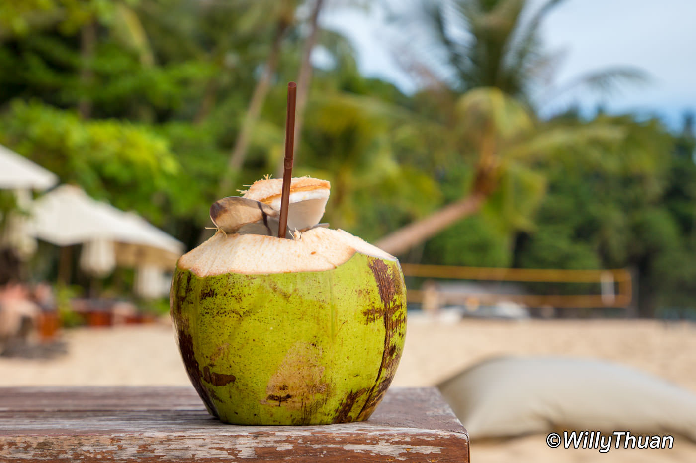 Having a coconut at the beach bar