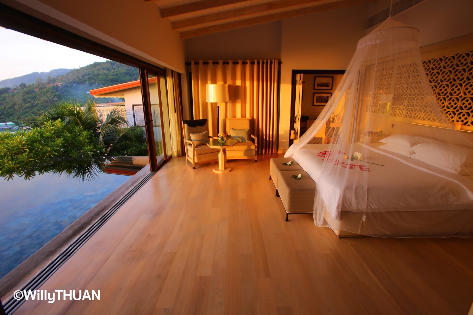 Sunset over the infinity pool from your bed