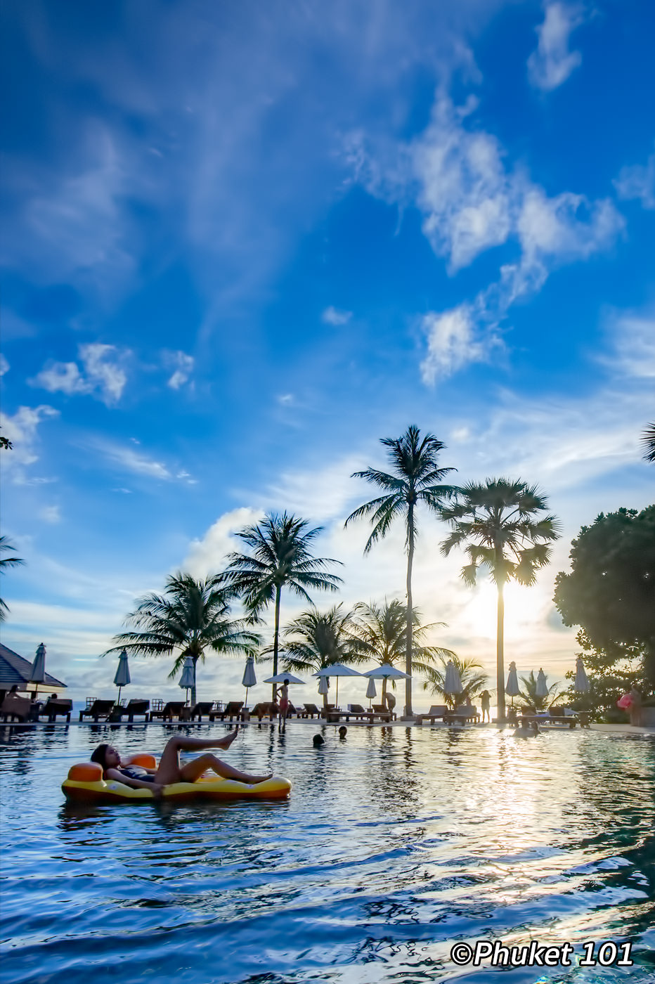 The swimming pool at sunset time