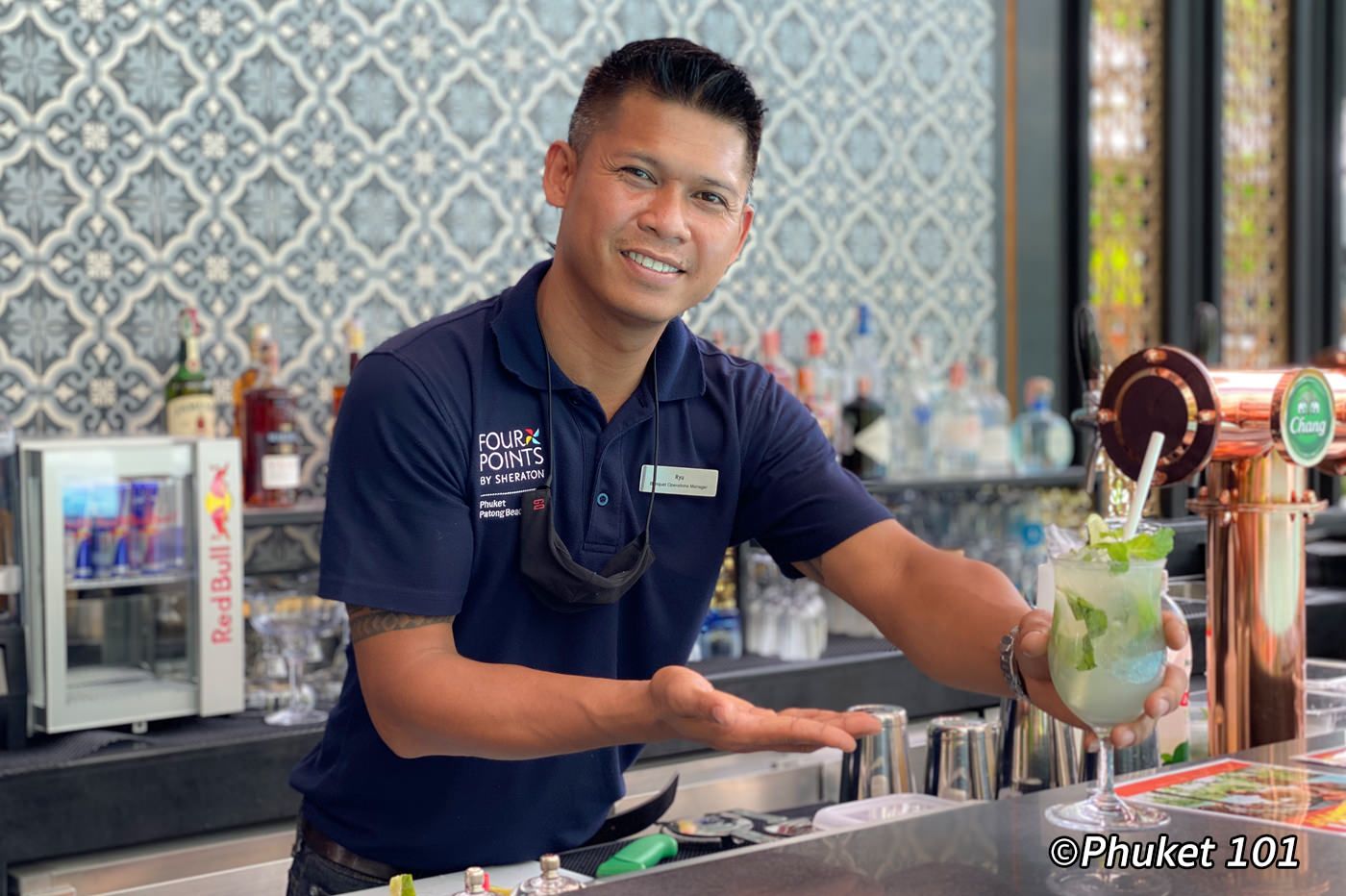 Skilled bar tender at the pool bar