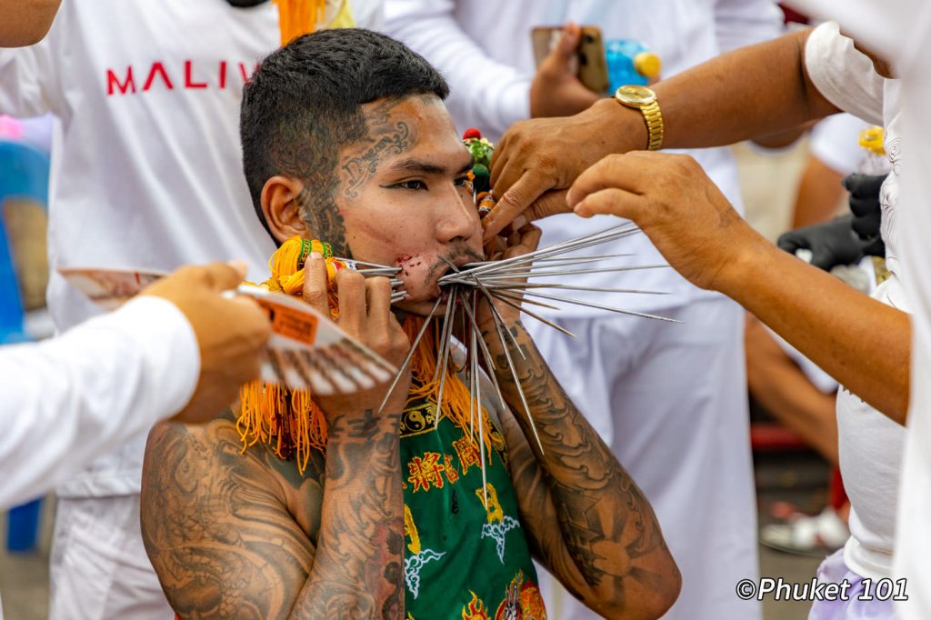 Spirit mediums with piercings through cheeks in Phuket Vegetarian Festival  procession, in Phuket, Thailand Stock Photo - Alamy