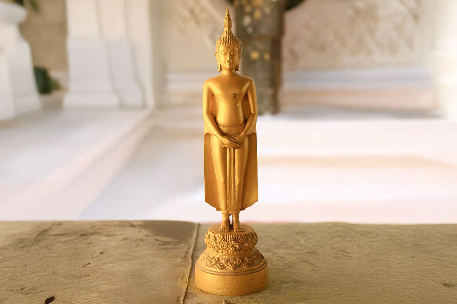 Sunday Buddha posture Pang Thawai Net (ปางถวายเนตร) - standing with arms crossed at waist