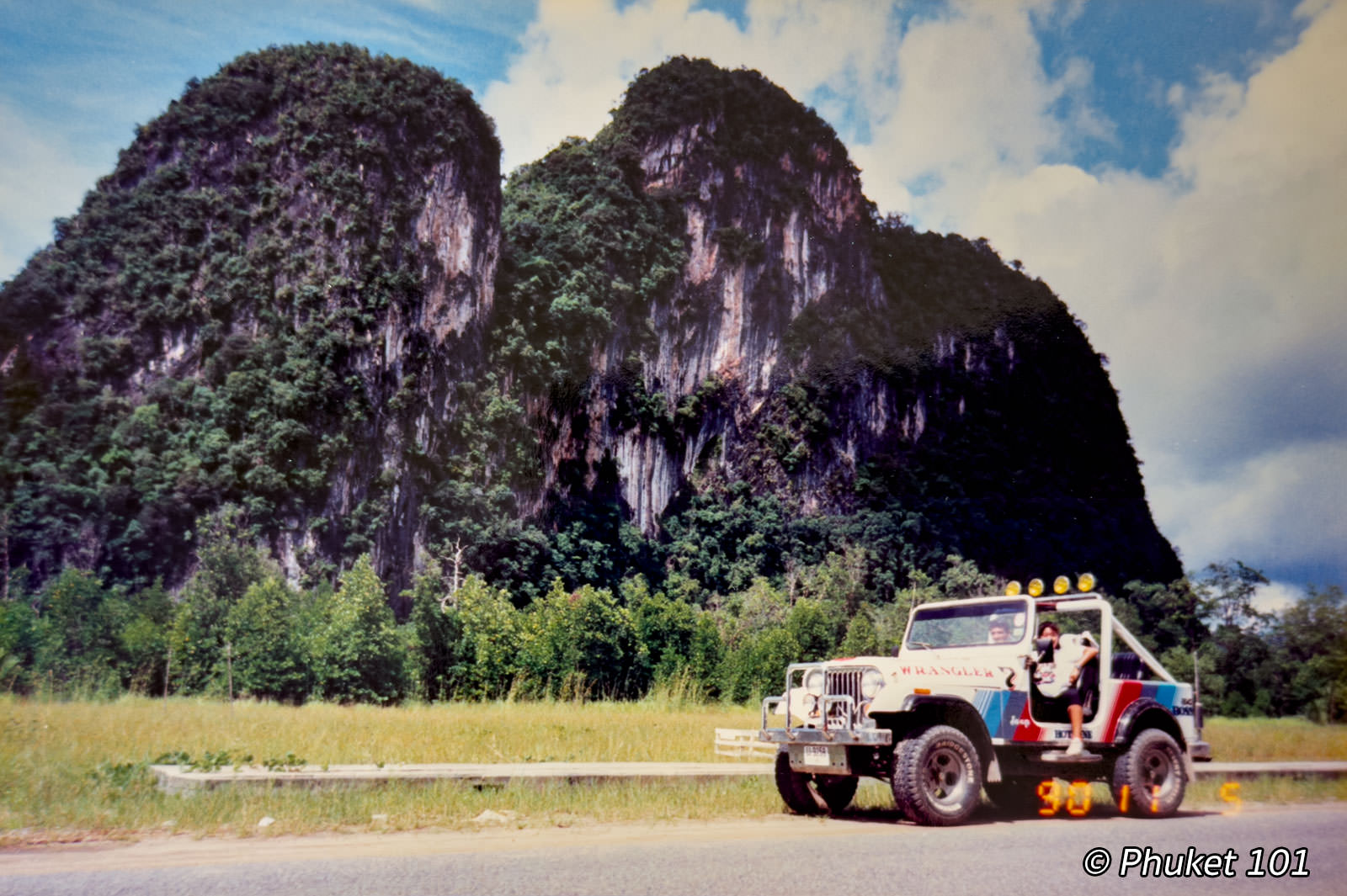 Jeep Wrangler on dirt road through Phang Nga limestone cliffs in 1990